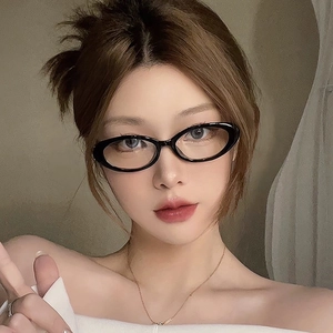 Vintage oval black full-rim glasses worn by a female model for a stylish retro look