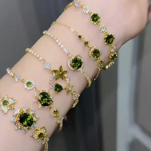 18k gold plated bracelet set with green zircon stones and geometric floral charms