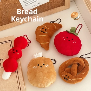 Detailed view of plush bread keychains with cute expressions and colorful bead chains