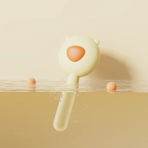 Waterproof pet grooming brush for cats and dogs with a cute cream and orange design