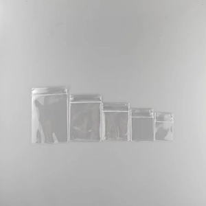 Five assorted sizes of clear PVC jewelry pouches with hanging holes and zippers