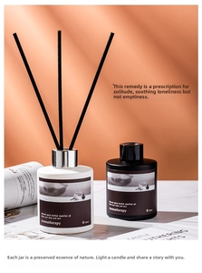 Close-up of elegant black and white aromatherapy reed diffusers with 120ml glass bottles