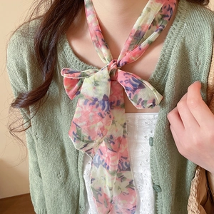 Close-up detail of an elegant floral mesh scarf necklace perfect for a pastoral feminine look