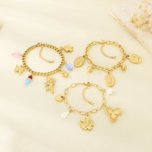 Gold stainless steel charm bracelets with angel, cross, and floral pendants