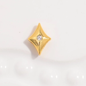 Macro shot of S925 sterling silver gold star charm with inlaid zircon and hallmark