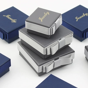 Dark green and gray jewelry gift boxes with silk ribbons and golden Jewelry text