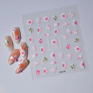 Close-up of FEB-748 self-adhesive floral nail stickers with pink magnolia and white petal designs