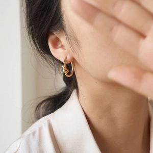 Minimalist 18k gold plated stainless steel hoop earrings with twist knot design