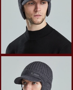 Close-up of dark grey thermal knit trapper hat with visor and Sport embroidery detail