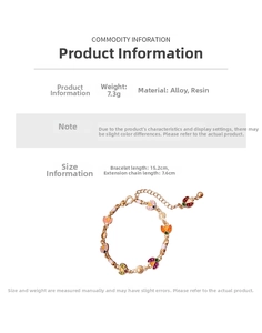 Detailed view of colorful enamel ladybug bracelet with lobster clasp and extension chain