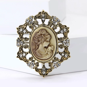 Vintage gold filigree brooch with cameo female profile portrait and sparkling rhinestones