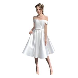 Elegant white off-the-shoulder satin wedding dress with a delicate bow belt and full skirt