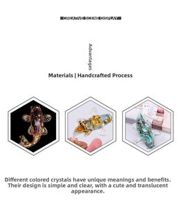 Detail of crystal resin koi fish ornaments with gold foil and natural stones inside