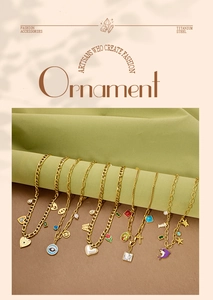 Detail of assorted titanium steel gold necklaces with heart and dolphin charms