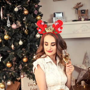 Festive glowing red reindeer antler headband with LED lights and golden crown detail