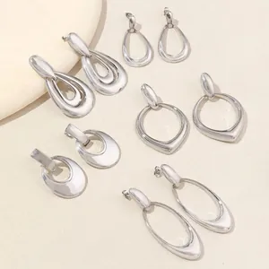 Minimalist silver geometric earrings set with polished drop and oval designs
