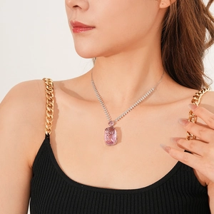 Close-up of elegant square-cut pink zircon pendant necklace worn on a silver chain