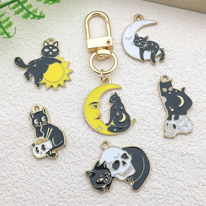 Cartoon enamel cat and moon pendant necklaces in black and white styles with gold metal