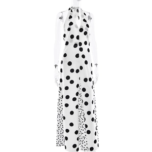 Detail view of white polka dot halter maxi dress with contrasting black pattern hem