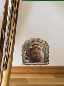 Détail d'un sticker mural 3D souris de Noël avec souris et biscuits sous une arche