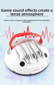 Close-up of polygraph toy with silver finger slots and heart rate pulse effects