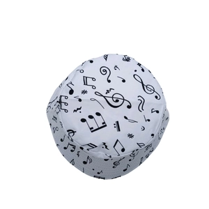 Top-down view of a white bucket hat with black musical notes and symbols print