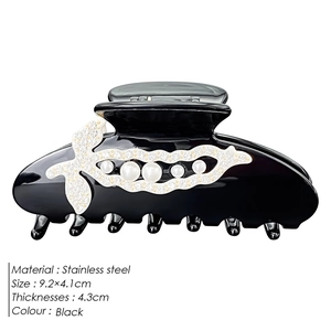 Elegant black resin hair claw clip with pearl pea pod design and stainless steel spring