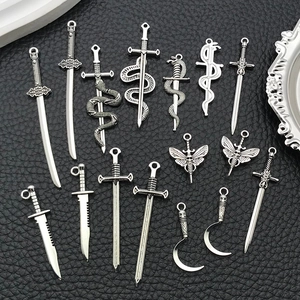 Gothic silver zinc alloy sword and dagger charms set for DIY jewelry making on black background