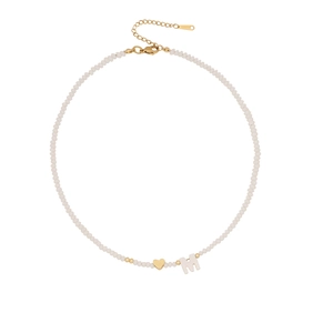 Handmade cream beaded necklace with golden heart and letter M shell pendant on white background