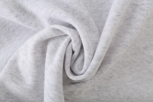 Detailed macro view of soft heather grey knitted fabric texture for hoodie set