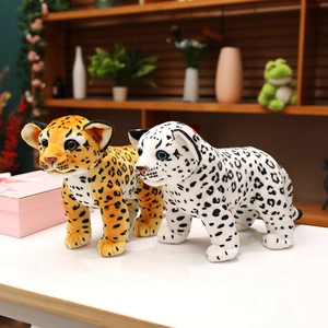 Lifelike plush leopard and snow leopard toys standing in a cozy home setting