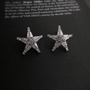 Luxury starfish stud earrings with sparkling crystals on a minimalist silver base