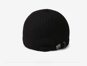 Detail view of the black baseball cap back with textured fabric and metal buckle adjustment