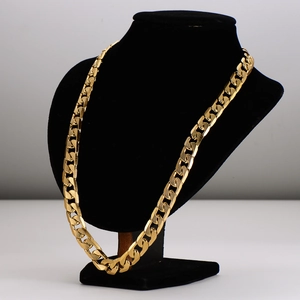 Gold-plated flat curb chain necklace with rhombus texture on an elegant display