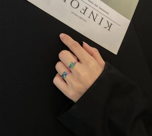 Detailed view of S925 silver open ring with colorful zircon paving on model hand