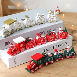 Three wooden Christmas train toys with snowmen and bears in white, red, and green colors
