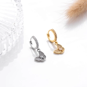 Elegant gold and silver butterfly earrings with zircon inlay against white background