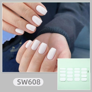 Detail of pure white solid color nail stickers SW608 showing application and full sheet