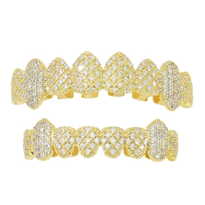 Hip hop gold teeth grillz set with sparkling cubic zirconia on white background