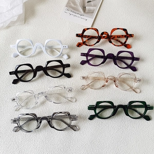 Detailed overhead view showing eight colorful retro square eyeglass frames in various shades
