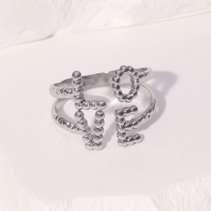 Adjustable silver stainless steel LOVE ring with textured beads and minimalist design