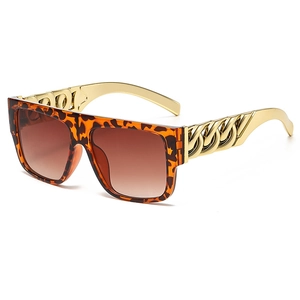 Fashionable leopard square sunglasses with gold chain temples and brown gradient lenses