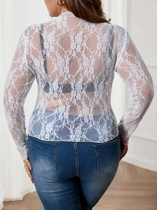 Detailed back view of white floral lace long sleeve top with sheer crochet texture