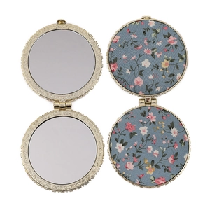 Vintage floral folding makeup mirror with blue fabric cover and gold metal frame