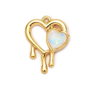 Macro shot of gold-plated lava heart pendant with iridescent gemstone inlay detail