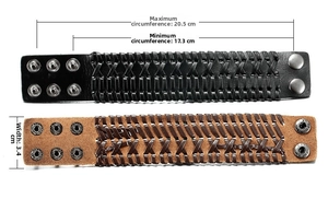 Detail view of woven leather bracelets in black and brown with adjustable metal snaps