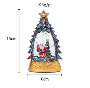 Close-up of golden Christmas tree snow globe with Santa Claus including size and weight specs