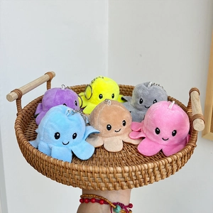 Colorful plush octopus keychain set in a woven basket featuring six vibrant pastel shades