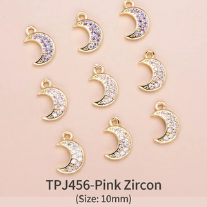 Detailed view of 10mm 18K gold plated moon pendants with pink zircon for DIY jewelry