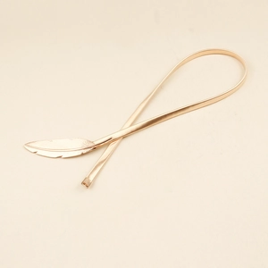 Golden metal spring waist chain with feather buckle for elegant dresses and coats